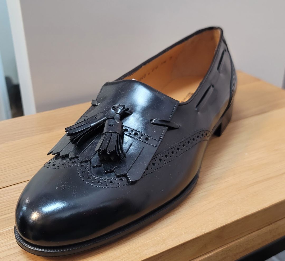 Black Salvatore Ferragamo tassle loafer, 11.5