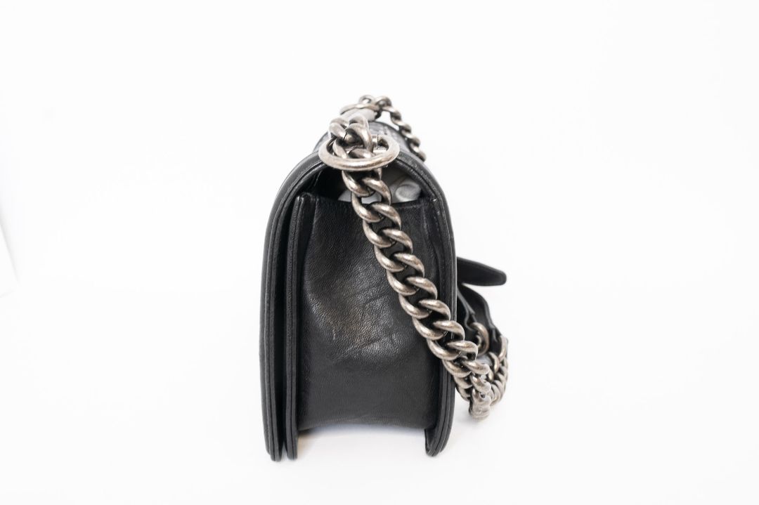 black Chanel Chanel Boy Bag, 📏 Dimensions (Approximate)    • Size: Medium    • Length: 9.8 in    • Height: 5.9 in    • Depth: 3.5 in    • Strap Drop (Single Chain): 11–12 in    • Strap Drop (Crossbody): ~20 in    • Style Code: A67086 (based on signature f