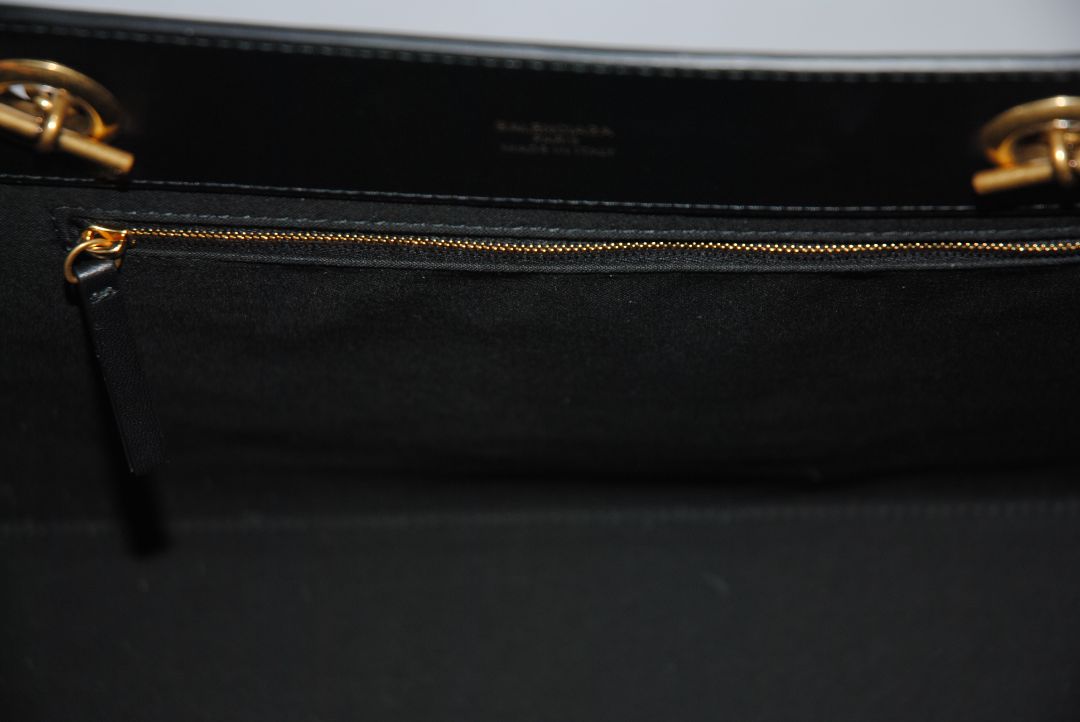Black Balenciaga Medium Shopping Tote in Black Calfskin Leather with Aged Gold Chain, Length: 13.8 in (35 cm) Height: 11.8 in (30 cm) Depth: 5.5 in (14 cm) Strap Drop: 11 in