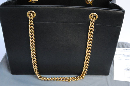Black Balenciaga Medium Shopping Tote in Black Calfskin Leather with Aged Gold Chain, Length: 13.8 in (35 cm) Height: 11.8 in (30 cm) Depth: 5.5 in (14 cm) Strap Drop: 11 in