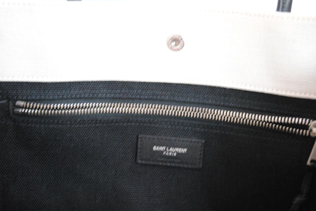 Black and White Yves Saint Laurent Rive Gauche Tote in Canvas and Leather, Length: 18.5 in (47 cm) Height: 14.2 in (36 cm) Width: 6.7 in (17 cm) Strap Drop: 17 in (removable shoulder strap) Handle Drop: 5 in