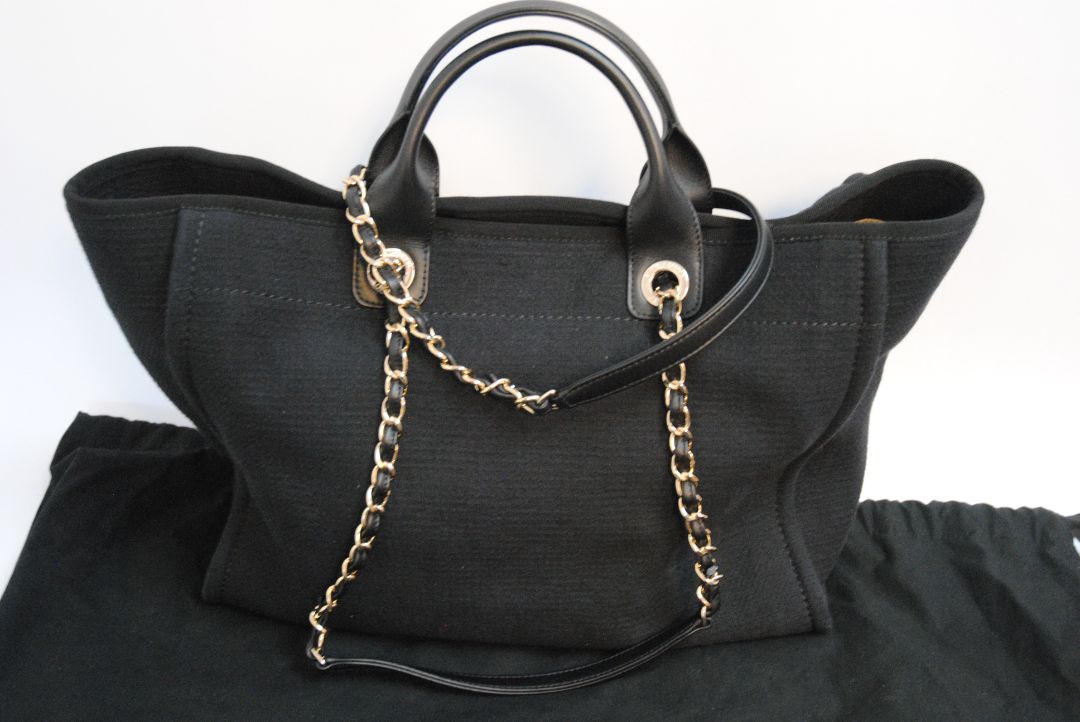 black Chanel Deauville Large Shopping Tote in Black Canvas with Leather Trim:, Length: 15 in (38 cm) Height: 11.5 in (29 cm) Depth: 6 in (15 cm) Handle Drop (top handles): 4.5 in Strap Drop (shoulder chains): 10 in