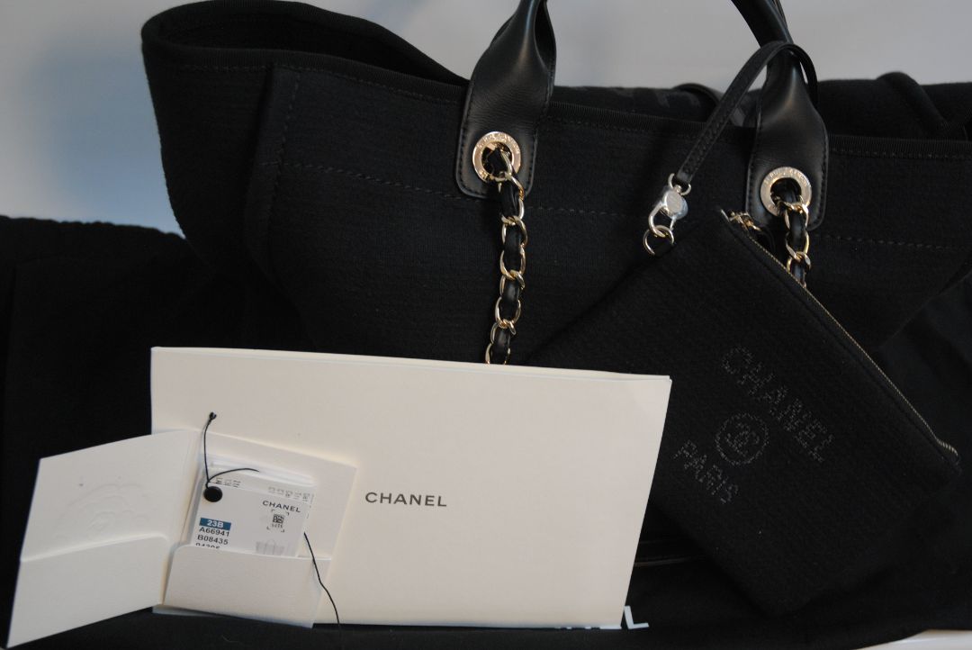 black Chanel Deauville Large Shopping Tote in Black Canvas with Leather Trim:, Length: 15 in (38 cm) Height: 11.5 in (29 cm) Depth: 6 in (15 cm) Handle Drop (top handles): 4.5 in Strap Drop (shoulder chains): 10 in