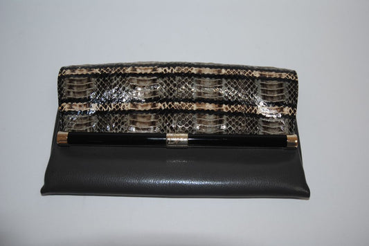 snake skin and gray Diane von Furstenberg clutch, Length: 11” Height: 6” Depth: 1.5” Closure: Bar frame with hinge clasp