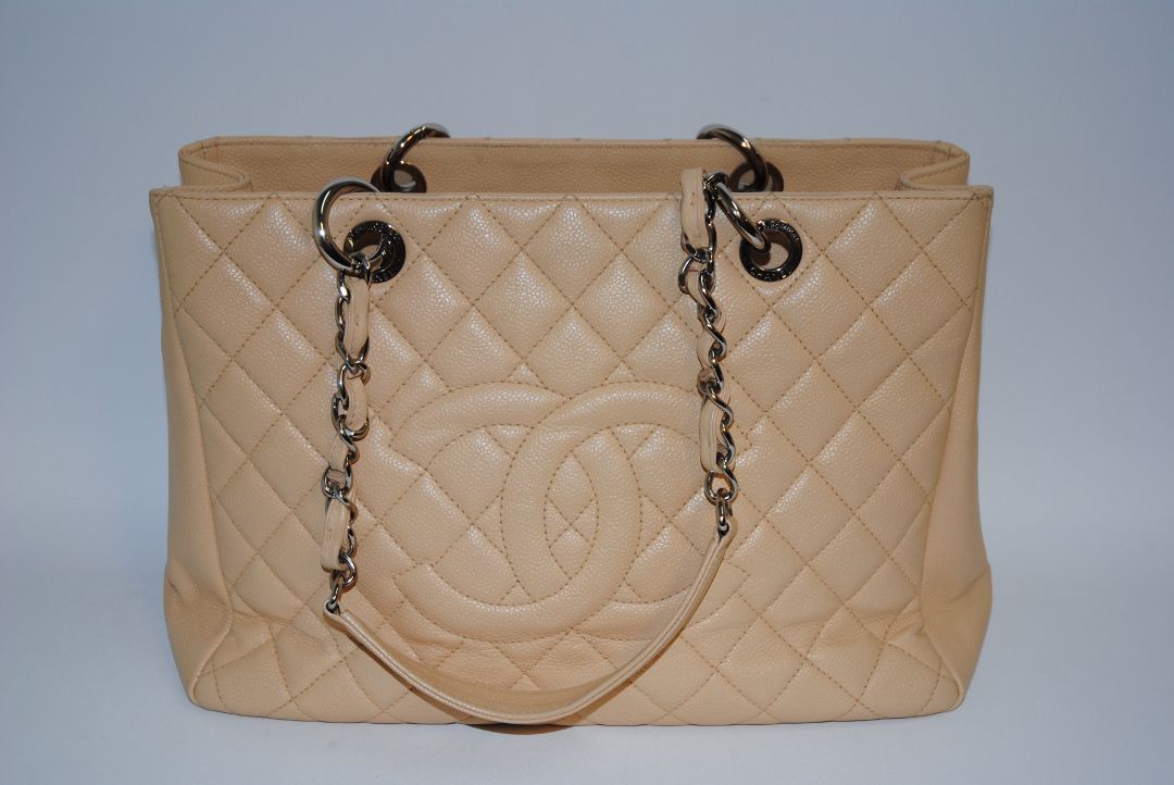 Beige Caviar Chanel Grand Shopping Tote (GST) in Caviar Leather with silver-tone, Length: 13.5 in Height: 10 in Depth: 5 in Handle Drop: 9 in