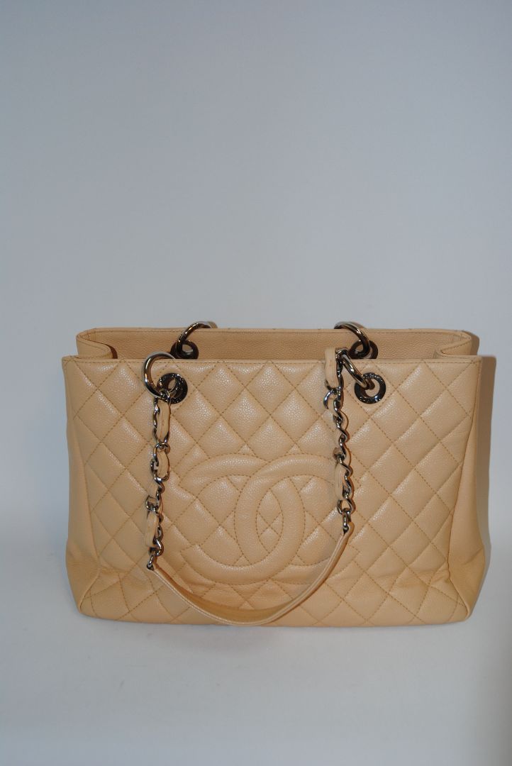 Beige Caviar Chanel Grand Shopping Tote (GST) in Caviar Leather with silver-tone, Length: 13.5 in Height: 10 in Depth: 5 in Handle Drop: 9 in