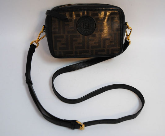 : Brown Zucca monogram Fendi rare Vintage Zucca Crossbody Camera Bag – Brown Canvas with Black Leather Trim, Length: 8.5 in (21.5 cm) Height: 6 in (15 cm) Depth: 2.5 in (6.5 cm) Strap Drop: 21–23 in (adjustable crossbody)