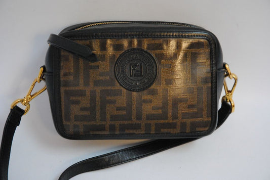 : Brown Zucca monogram Fendi rare Vintage Zucca Crossbody Camera Bag – Brown Canvas with Black Leather Trim, Length: 8.5 in (21.5 cm) Height: 6 in (15 cm) Depth: 2.5 in (6.5 cm) Strap Drop: 21–23 in (adjustable crossbody)