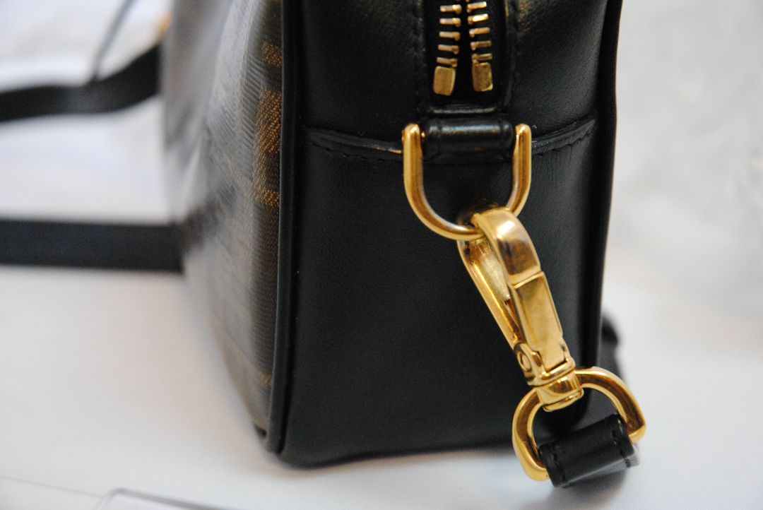 : Brown Zucca monogram Fendi rare Vintage Zucca Crossbody Camera Bag – Brown Canvas with Black Leather Trim, Length: 8.5 in (21.5 cm) Height: 6 in (15 cm) Depth: 2.5 in (6.5 cm) Strap Drop: 21–23 in (adjustable crossbody)