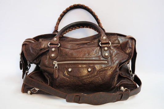 brown Balenciaga Classic City Bag – Distressed Brown Leather with Silver Hardware, Length: 15 in (38 cm) Height: 10 in (25 cm) Depth: 5.5 in (14 cm) Handle Drop: 4 in Strap Drop: 10–12 in (adjustable, removable shoulder strap)