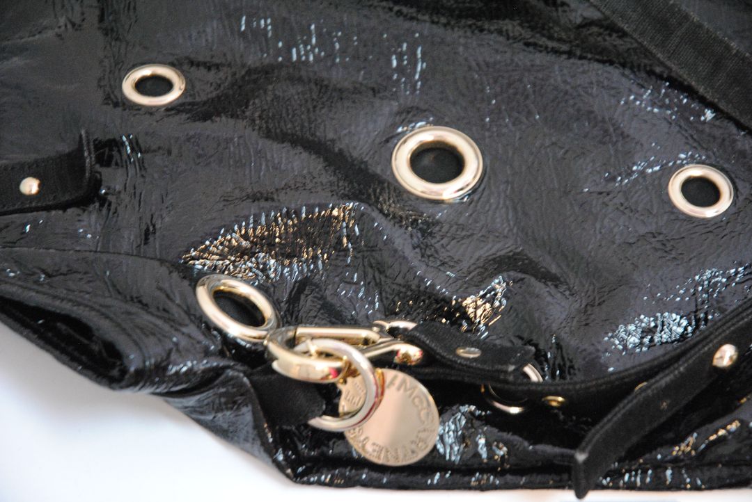 black Stella McCartney grommet patent eco tote, Length: 18 in (46 cm) Height: 16 in (41 cm) Depth: 5 in (13 cm) Top Handle Drop: 4 in Shoulder Strap Drop: Adjustable up to 20 in (Ideal for top-handle or crossbody wear)
