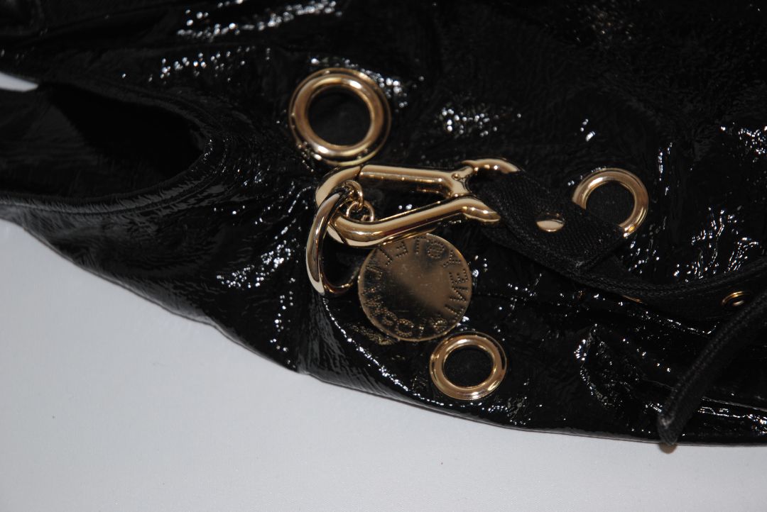 black Stella McCartney grommet patent eco tote, Length: 18 in (46 cm) Height: 16 in (41 cm) Depth: 5 in (13 cm) Top Handle Drop: 4 in Shoulder Strap Drop: Adjustable up to 20 in (Ideal for top-handle or crossbody wear)