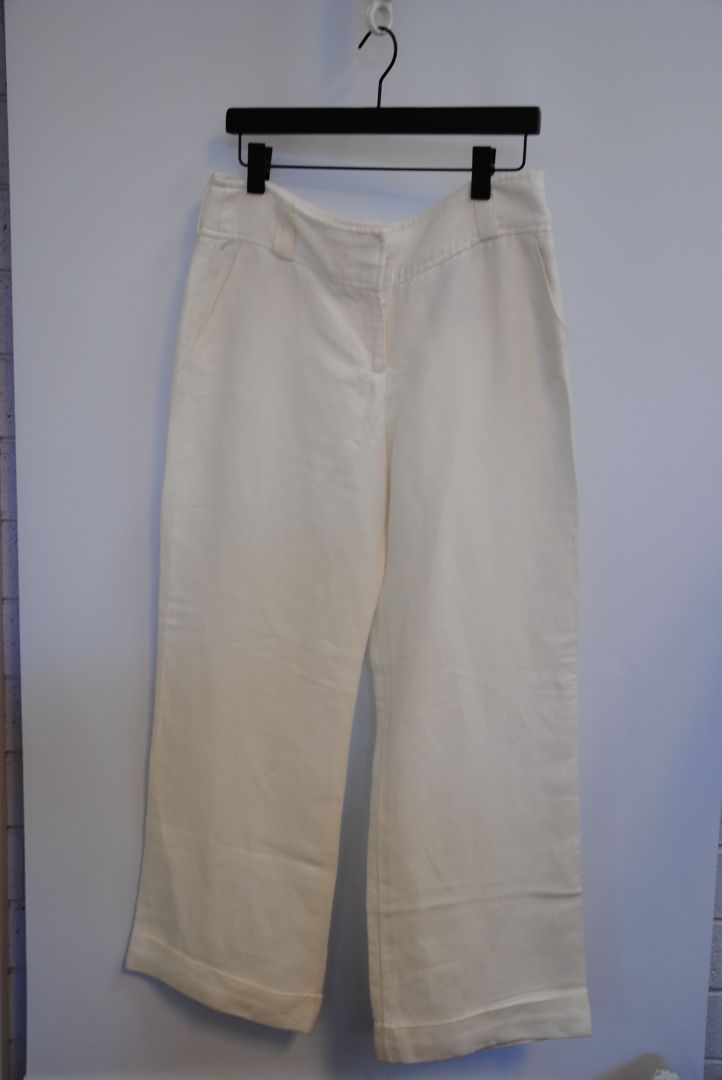 ivory Burberry linen trousers, Waist: 15 in (flat) Rise: 11 in Inseam: 30 in Hip: 19 in (flat) Leg Opening: 9.5 in Length: 41 in Closure: Hidden hook-and-zip front Fit: Mid-to-high rise, relaxed wide-leg silhouette