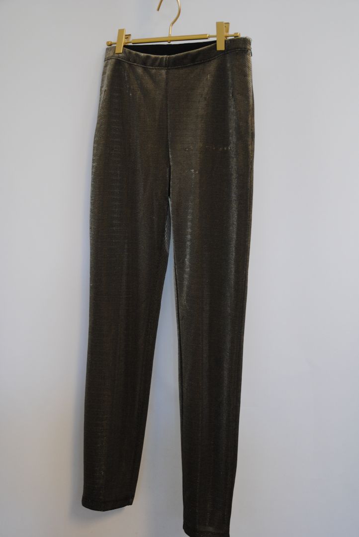bronze Jean Paul Gaultier metallic trousers, Waist (flat, unstretched): 13.5 in Rise: 10.5 in Inseam: 29 in Hip: 18 in Leg Opening: 6 in Fit: Slim with light taper; stretch pull-on style