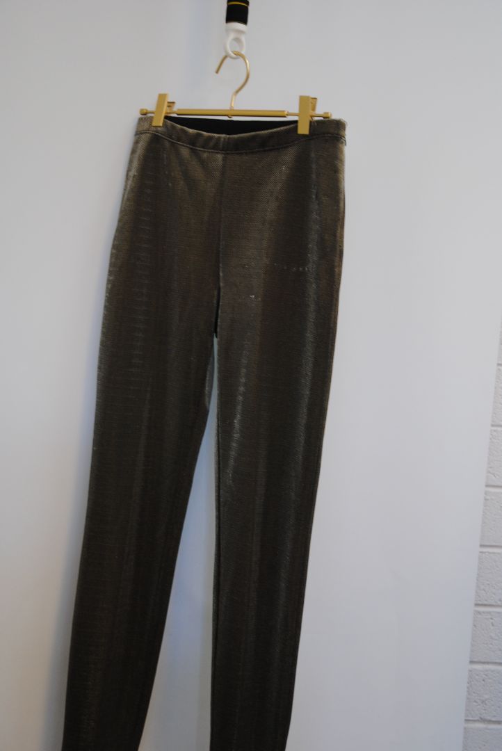 bronze Jean Paul Gaultier metallic trousers, Waist (flat, unstretched): 13.5 in Rise: 10.5 in Inseam: 29 in Hip: 18 in Leg Opening: 6 in Fit: Slim with light taper; stretch pull-on style