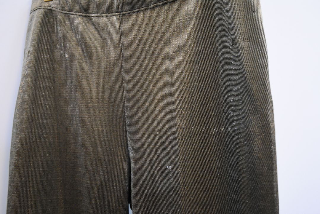 bronze Jean Paul Gaultier metallic trousers, Waist (flat, unstretched): 13.5 in Rise: 10.5 in Inseam: 29 in Hip: 18 in Leg Opening: 6 in Fit: Slim with light taper; stretch pull-on style