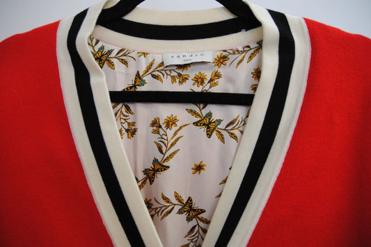 red Sandro knit cardigan, Bust (flat): 19.5 in Length (shoulder to hem): 27 in Sleeve Length: 21.5 in Shoulder to Shoulder: 17 in Fit: Relaxed, hip-length silhouette Closure: Button-down front