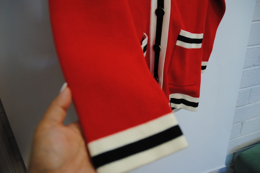 red Sandro knit cardigan, Bust (flat): 19.5 in Length (shoulder to hem): 27 in Sleeve Length: 21.5 in Shoulder to Shoulder: 17 in Fit: Relaxed, hip-length silhouette Closure: Button-down front
