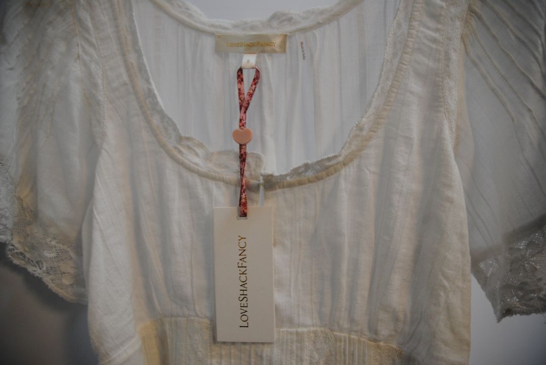 white Love Shack Fancy gwen pintuck dress, Bust: 34 in Waist: 28 in (elastic smocking in back) Length: 31 in (shoulder to hem) Sleeve Length: 10 in Fit: Flowy, relaxed fit with slight empire waist