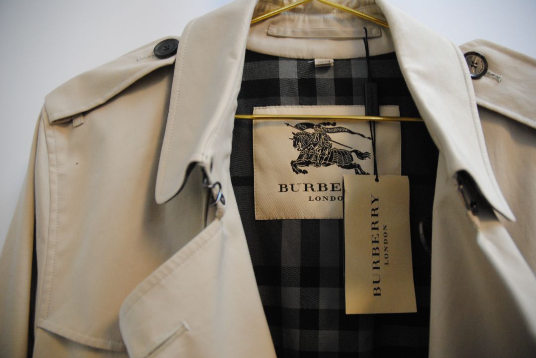 beige and cream Burberry London trench coat, Shoulder to Shoulder: 16.5 in Bust: 39–40 in Sleeve Length: 24.5 in Waist: 38 in Length: 36–37 in (mid-thigh to above knee) Fit: Tailored classic fit