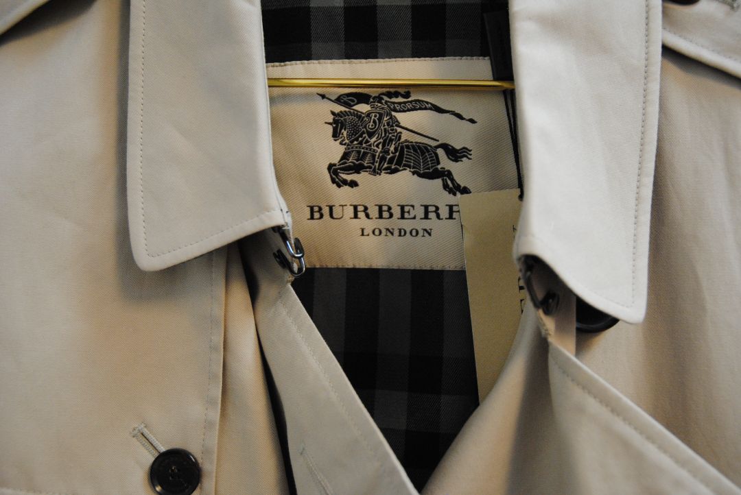 beige and cream Burberry London trench coat, Shoulder to Shoulder: 16.5 in Bust: 39–40 in Sleeve Length: 24.5 in Waist: 38 in Length: 36–37 in (mid-thigh to above knee) Fit: Tailored classic fit