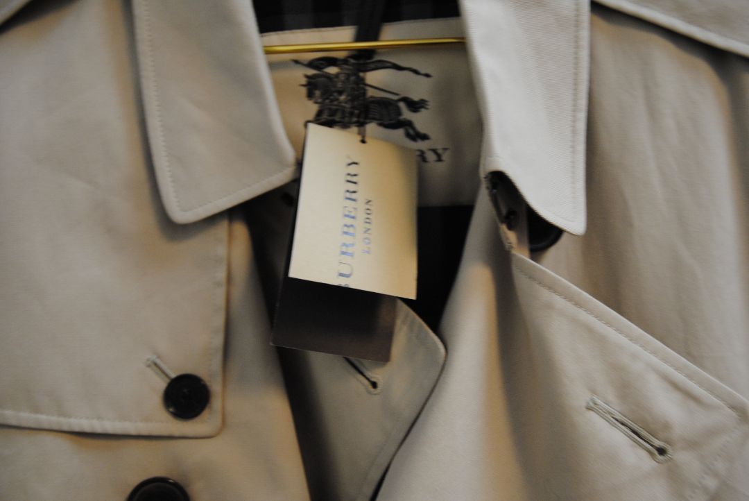 beige and cream Burberry London trench coat, Shoulder to Shoulder: 16.5 in Bust: 39–40 in Sleeve Length: 24.5 in Waist: 38 in Length: 36–37 in (mid-thigh to above knee) Fit: Tailored classic fit