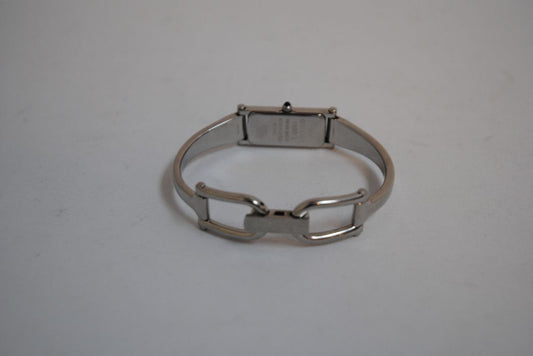 black and silver Gucci rectangle bangle watch, Case Dimensions: Approx. 15 mm width x 35 mm height Band Width: Approx. 10 mm