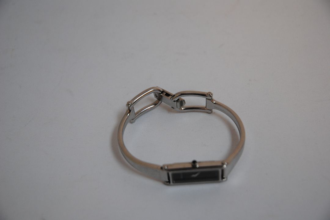 black and silver Gucci rectangle bangle watch, Case Dimensions: Approx. 15 mm width x 35 mm height Band Width: Approx. 10 mm