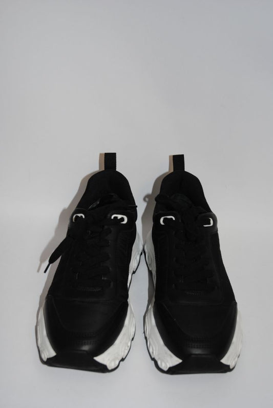 black and white Hermès Bouncing Sneaker, Heel Height: 1.5 in Platform: 1.25 in Fit: True to size (standard men’s sizing; this appears to be ~EU 41–43) Weight: Lightweight EVA sole (typical of Bouncing/Trail line)