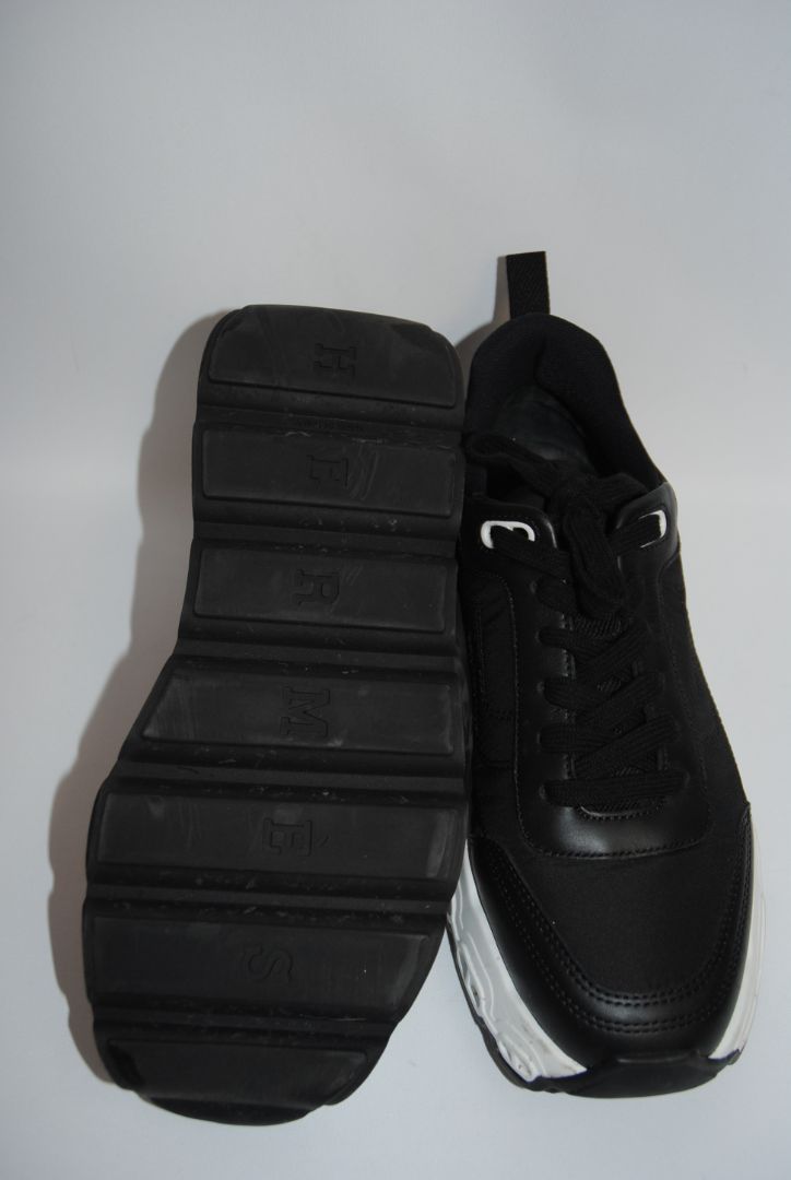 black and white Hermès Bouncing Sneaker, Heel Height: 1.5 in Platform: 1.25 in Fit: True to size (standard men’s sizing; this appears to be ~EU 41–43) Weight: Lightweight EVA sole (typical of Bouncing/Trail line)