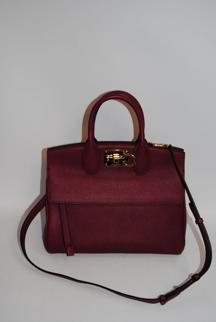 deep raspberry Salvatore Ferragamo Gancini top handle cross body, Length: 10.5 in Height: 8.25 in Depth: 5 in Top Handle Drop: 4 in Strap Drop: Adjustable, approx. 18β22 in