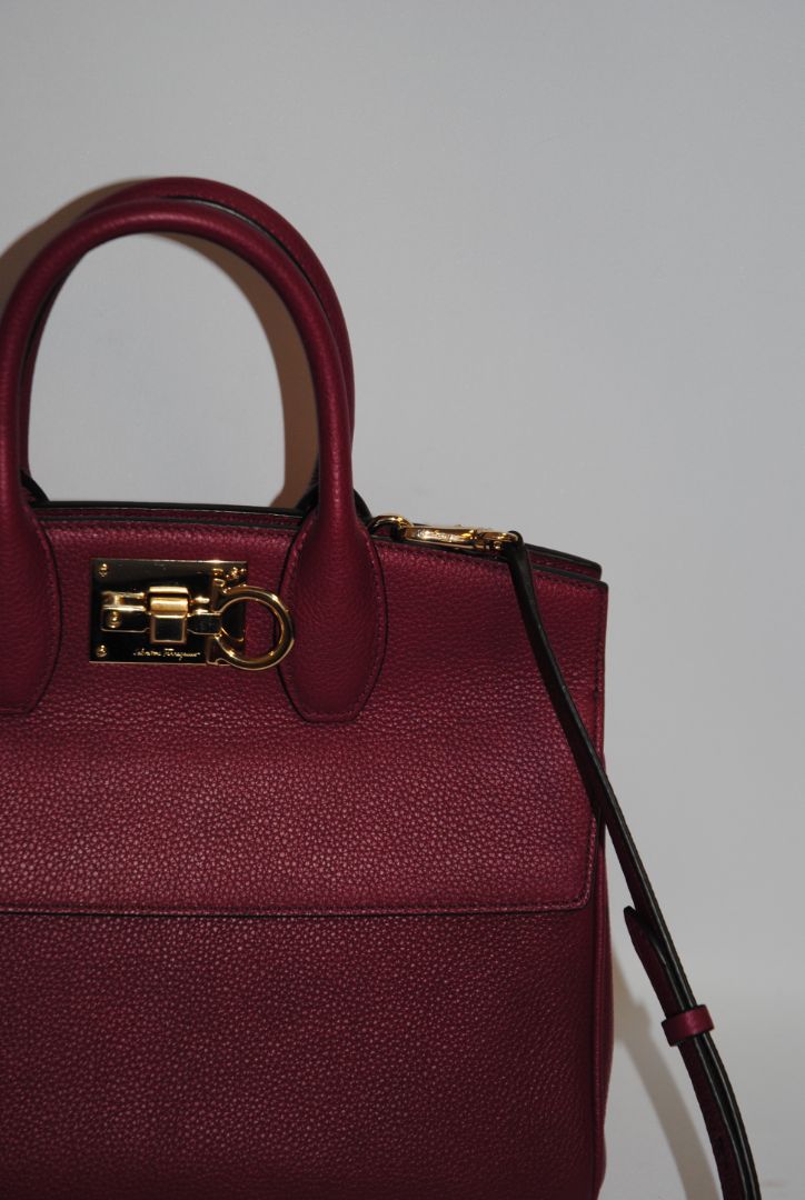 deep raspberry Salvatore Ferragamo Gancini top handle cross body, Length: 10.5 in Height: 8.25 in Depth: 5 in Top Handle Drop: 4 in Strap Drop: Adjustable, approx. 18β22 in