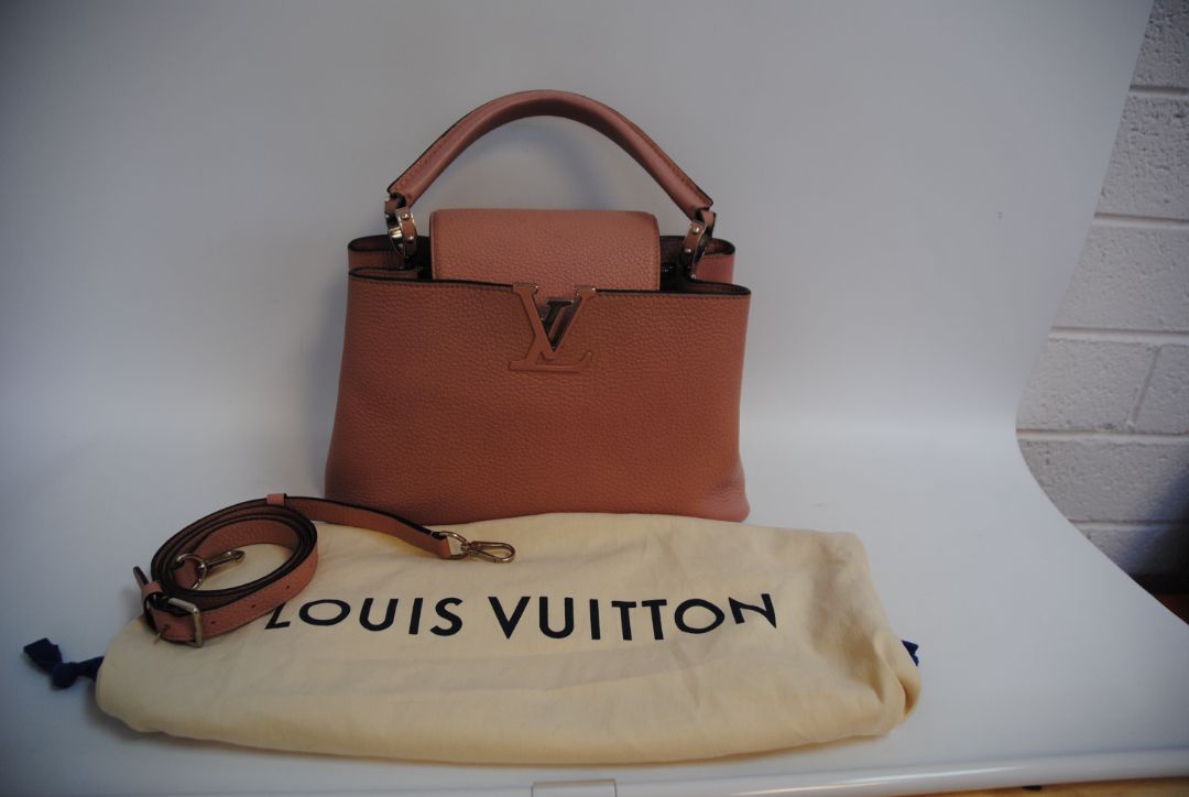 Magnolia Pink Louis Vuitton Capucines BB β Magnolia Pink Taurillon Leather with Silver Hardware, Length: 10.6 in (27 cm) Height: 7 in (18 cm) Depth: 3.5 in (9 cm) Top Handle Drop: 3.5 in (9 cm) Strap Drop: 18β21 in (adjustable/removable)