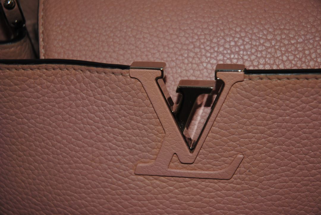 Magnolia Pink Louis Vuitton Capucines BB β Magnolia Pink Taurillon Leather with Silver Hardware, Length: 10.6 in (27 cm) Height: 7 in (18 cm) Depth: 3.5 in (9 cm) Top Handle Drop: 3.5 in (9 cm) Strap Drop: 18β21 in (adjustable/removable)