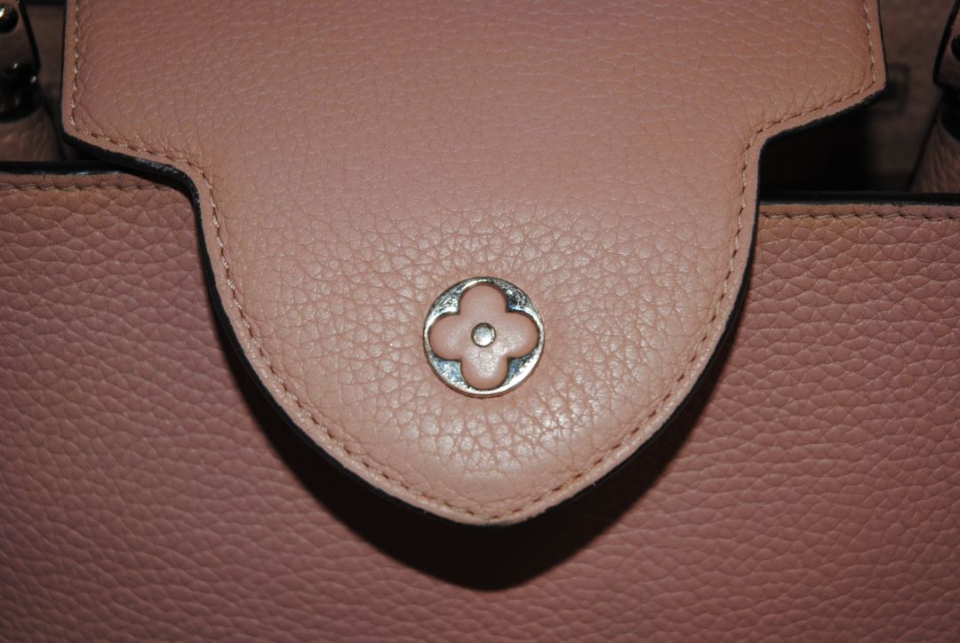 Magnolia Pink Louis Vuitton Capucines BB β Magnolia Pink Taurillon Leather with Silver Hardware, Length: 10.6 in (27 cm) Height: 7 in (18 cm) Depth: 3.5 in (9 cm) Top Handle Drop: 3.5 in (9 cm) Strap Drop: 18β21 in (adjustable/removable)