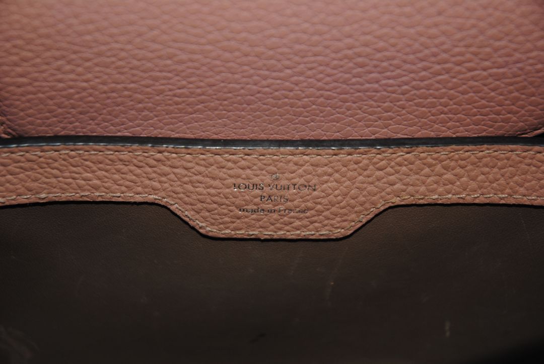 Magnolia Pink Louis Vuitton Capucines BB β Magnolia Pink Taurillon Leather with Silver Hardware, Length: 10.6 in (27 cm) Height: 7 in (18 cm) Depth: 3.5 in (9 cm) Top Handle Drop: 3.5 in (9 cm) Strap Drop: 18β21 in (adjustable/removable)