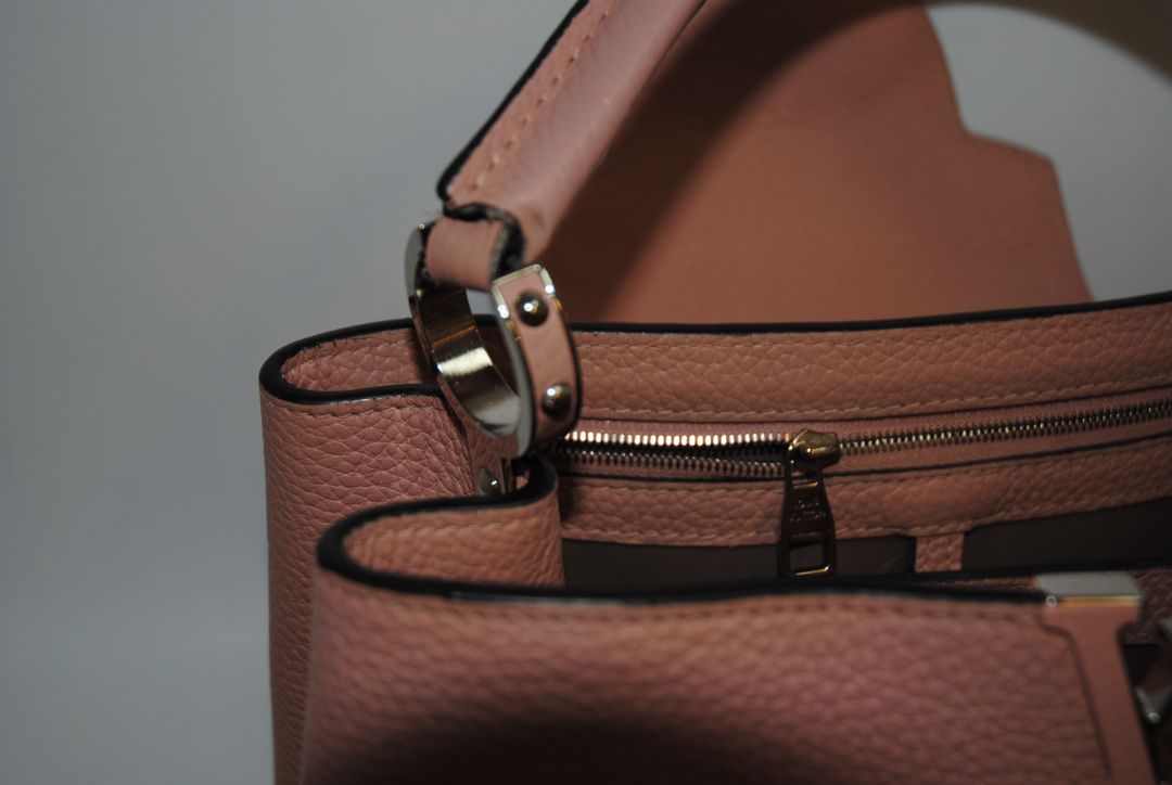 Magnolia Pink Louis Vuitton Capucines BB β Magnolia Pink Taurillon Leather with Silver Hardware, Length: 10.6 in (27 cm) Height: 7 in (18 cm) Depth: 3.5 in (9 cm) Top Handle Drop: 3.5 in (9 cm) Strap Drop: 18β21 in (adjustable/removable)