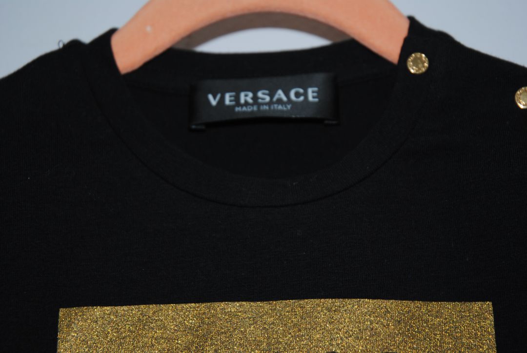 black and gold Versace logo and bottom Barouque, 24 mos