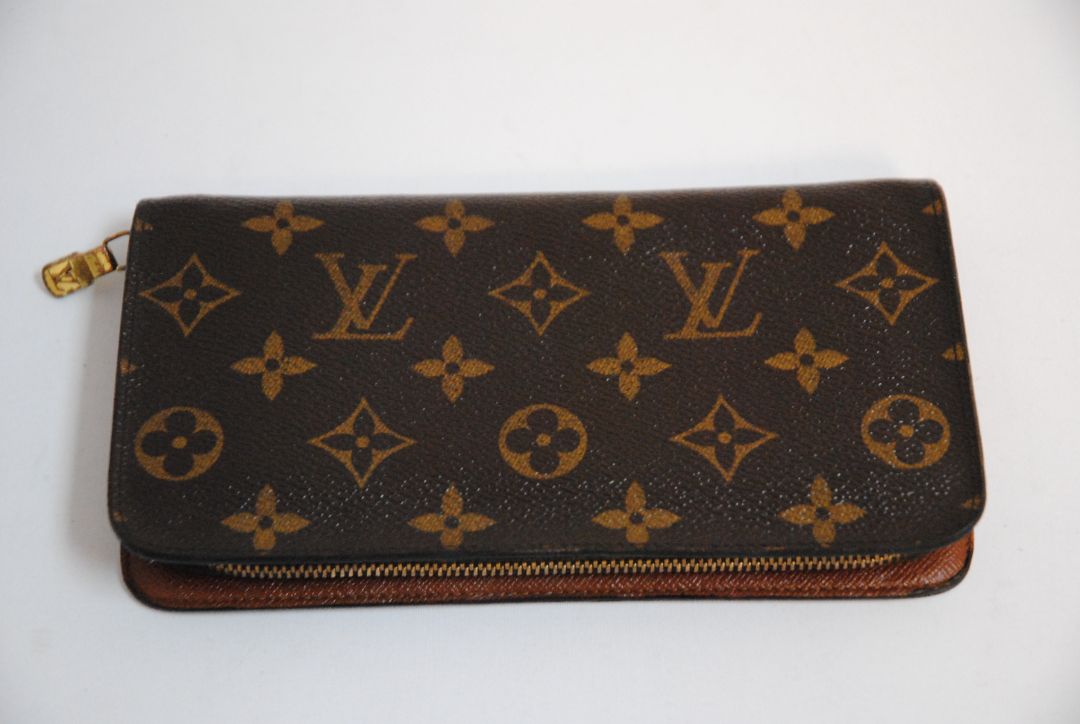 brown monogram Louis Vuitton Zippy Monogram Wallet, Approx. 7.7” W x 4.1” H x 1” D Long continental-style silhouette