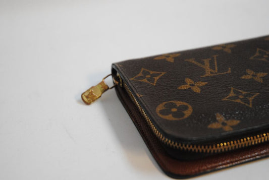 brown monogram Louis Vuitton Zippy Monogram Wallet, Approx. 7.7” W x 4.1” H x 1” D Long continental-style silhouette