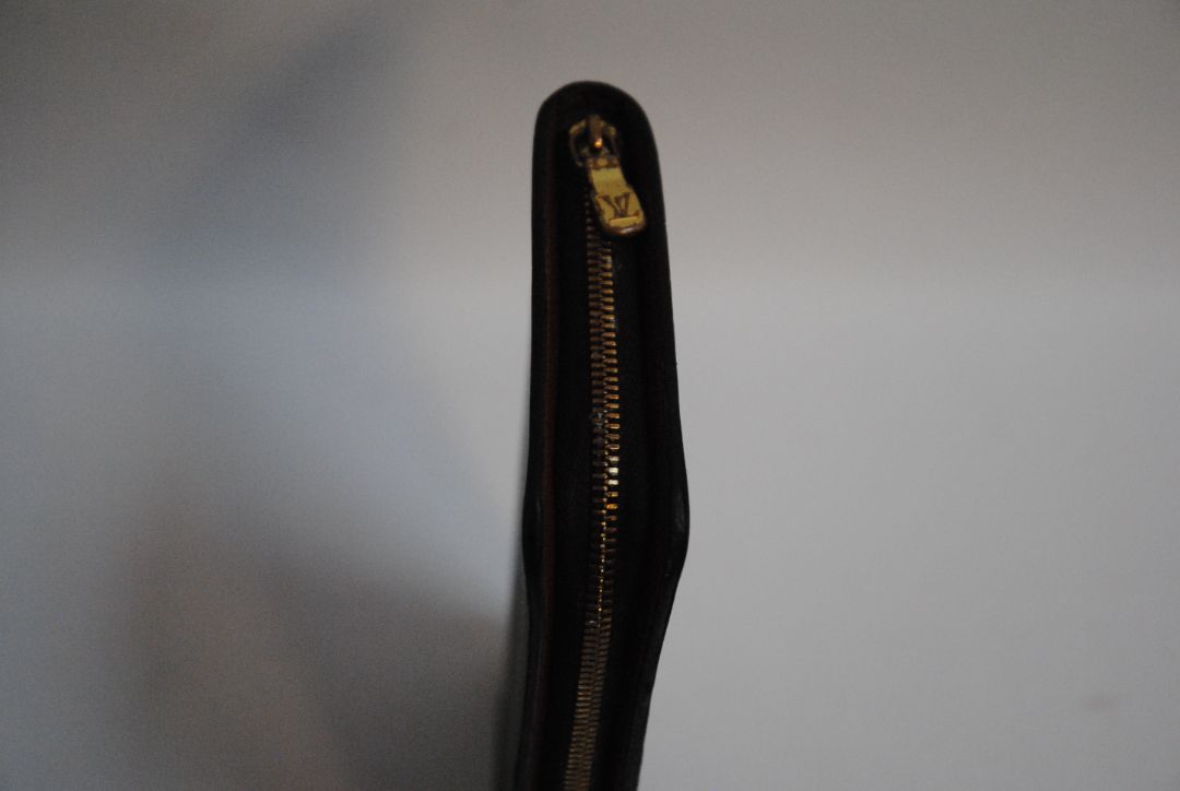 brown monogram Louis Vuitton Zippy Monogram Wallet, Approx. 7.7” W x 4.1” H x 1” D Long continental-style silhouette