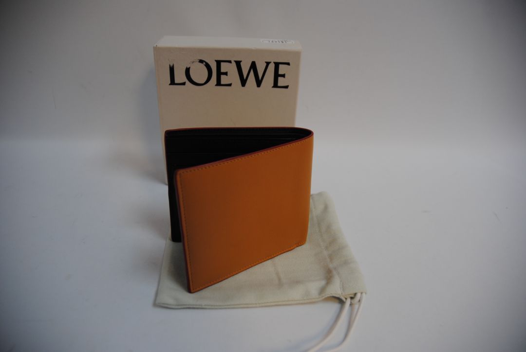 mustard yellow Loewe Embossed anagram bifold wallet, Length: 4.3 in (11 cm) Height: 3.5 in (9 cm) Depth: 0.6 in (1.5 cm)