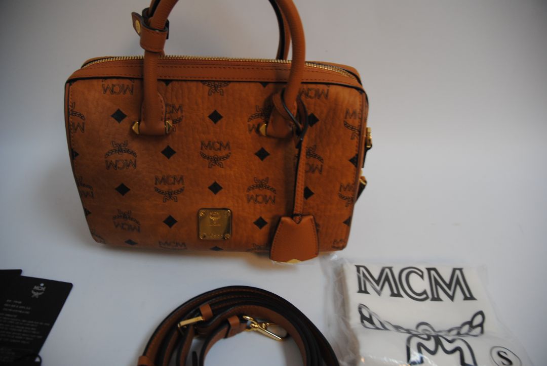 cognac MCM Essential Boston Bag – Medium, Length: 11.8 in (30 cm) Height: 7.5 in (19 cm) Depth: 6.7 in (17 cm) Handle Drop: 4 in (10 cm) Strap Drop: Adjustable up to 22 in (crossbody)