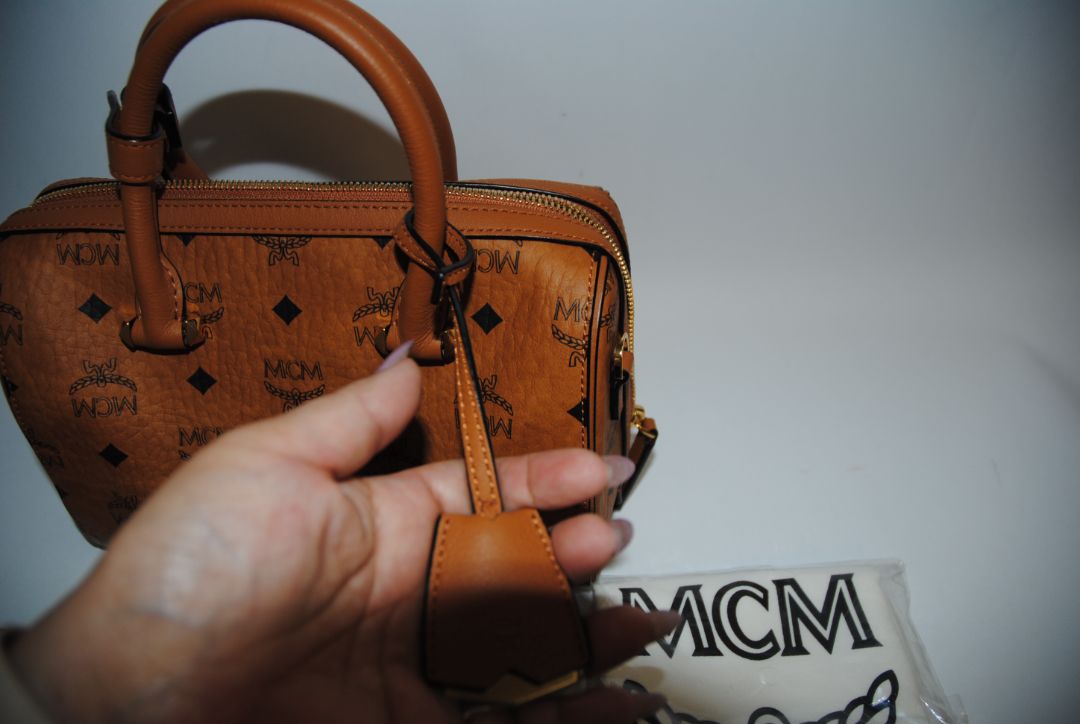 cognac MCM Essential Boston Bag – Medium, Length: 11.8 in (30 cm) Height: 7.5 in (19 cm) Depth: 6.7 in (17 cm) Handle Drop: 4 in (10 cm) Strap Drop: Adjustable up to 22 in (crossbody)