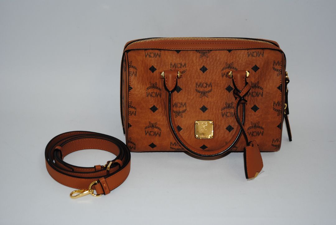 cognac MCM Essential Boston Bag – Medium, Length: 11.8 in (30 cm) Height: 7.5 in (19 cm) Depth: 6.7 in (17 cm) Handle Drop: 4 in (10 cm) Strap Drop: Adjustable up to 22 in (crossbody)