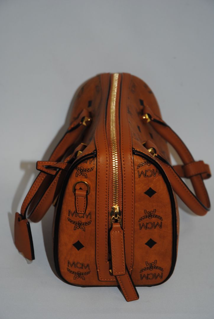 cognac MCM Essential Boston Bag – Medium, Length: 11.8 in (30 cm) Height: 7.5 in (19 cm) Depth: 6.7 in (17 cm) Handle Drop: 4 in (10 cm) Strap Drop: Adjustable up to 22 in (crossbody)