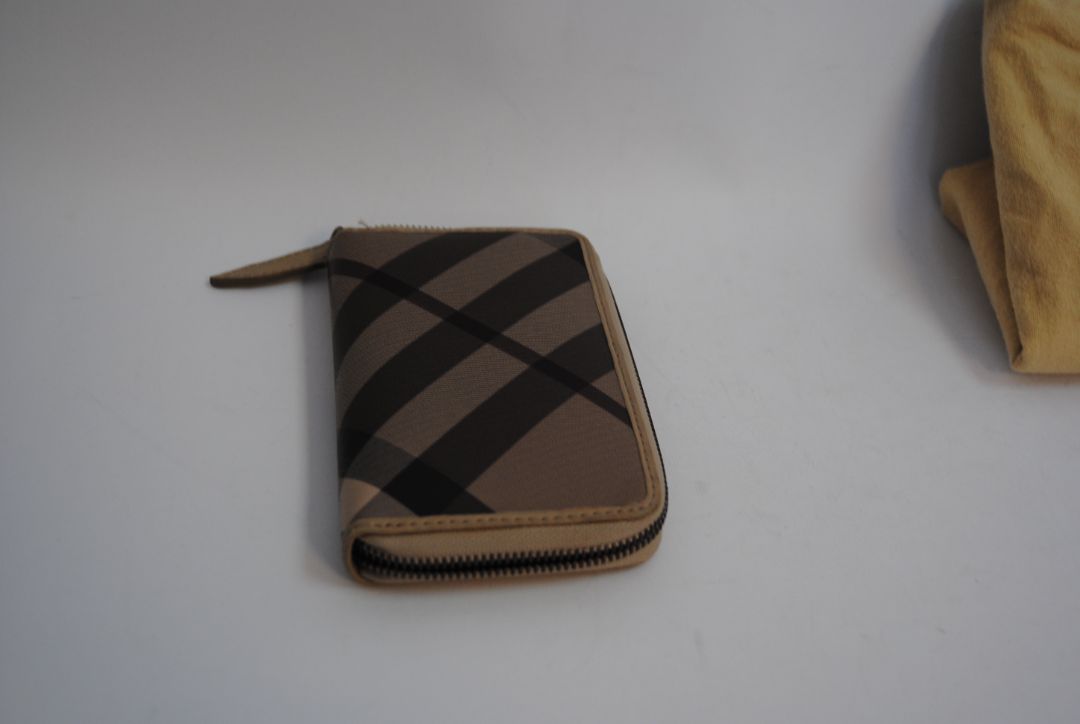 taupe/tan Burberry Zip-Around 12 card Wallet / Card Holder, Length: 4.5 in (11.4 cm) Height: 2.75 in (7 cm) Depth: 0.75 in (2 cm)