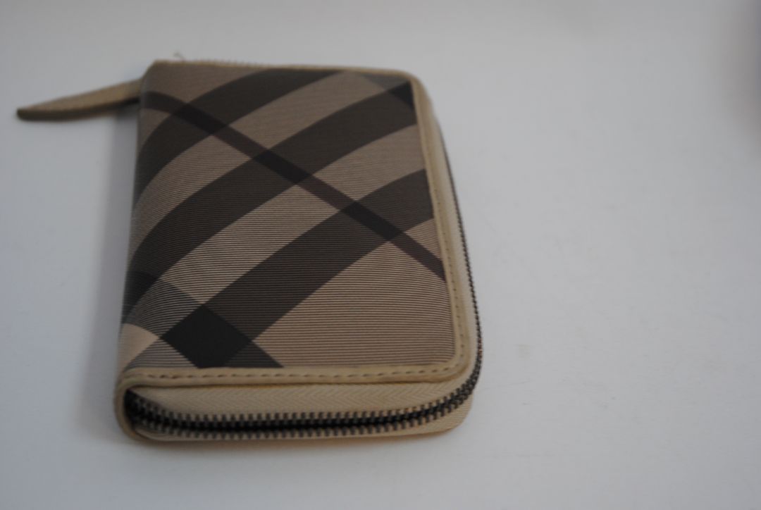 taupe/tan Burberry Zip-Around 12 card Wallet / Card Holder, Length: 4.5 in (11.4 cm) Height: 2.75 in (7 cm) Depth: 0.75 in (2 cm)