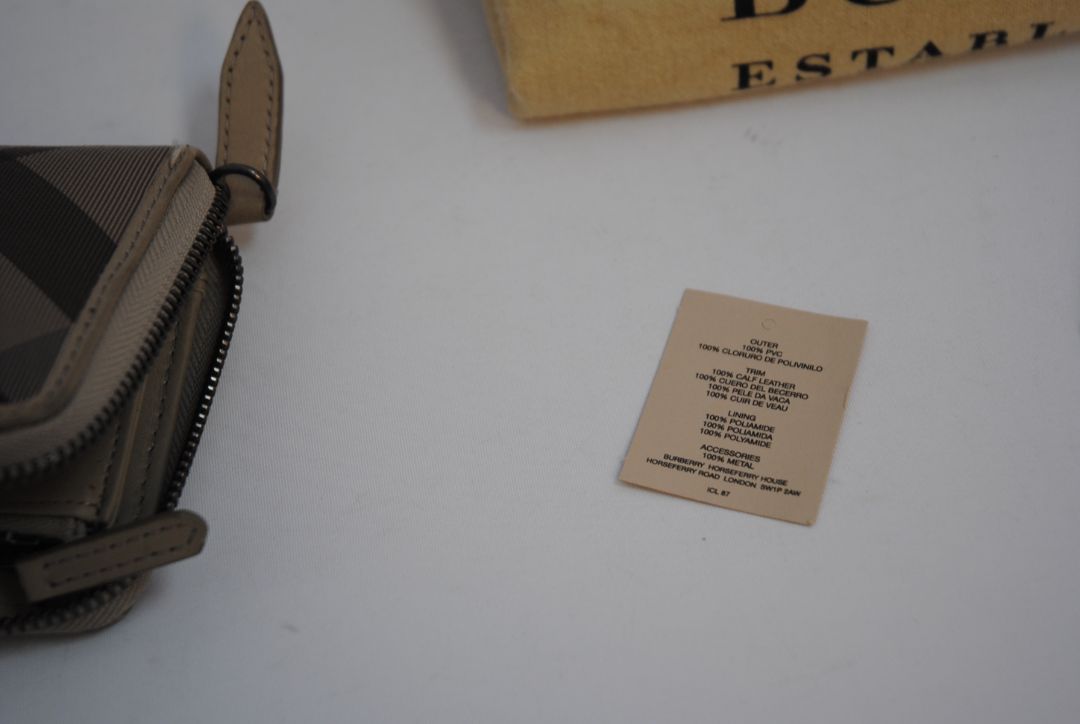 taupe/tan Burberry Zip-Around 12 card Wallet / Card Holder, Length: 4.5 in (11.4 cm) Height: 2.75 in (7 cm) Depth: 0.75 in (2 cm)