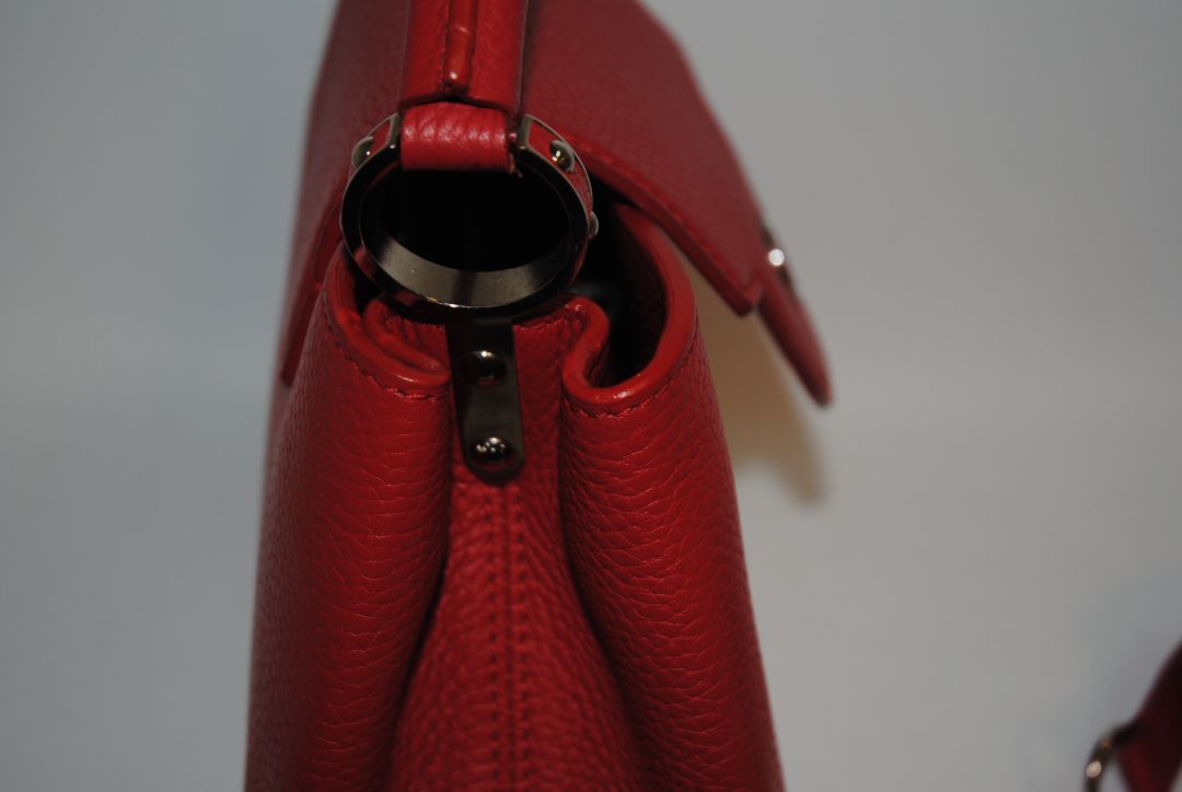 red taurillion leather Louis Vuitton Capucines Nano, measures 6.4 × 4.3 × 2.6 inches (16.3 × 10.9 × 6.6 cm).